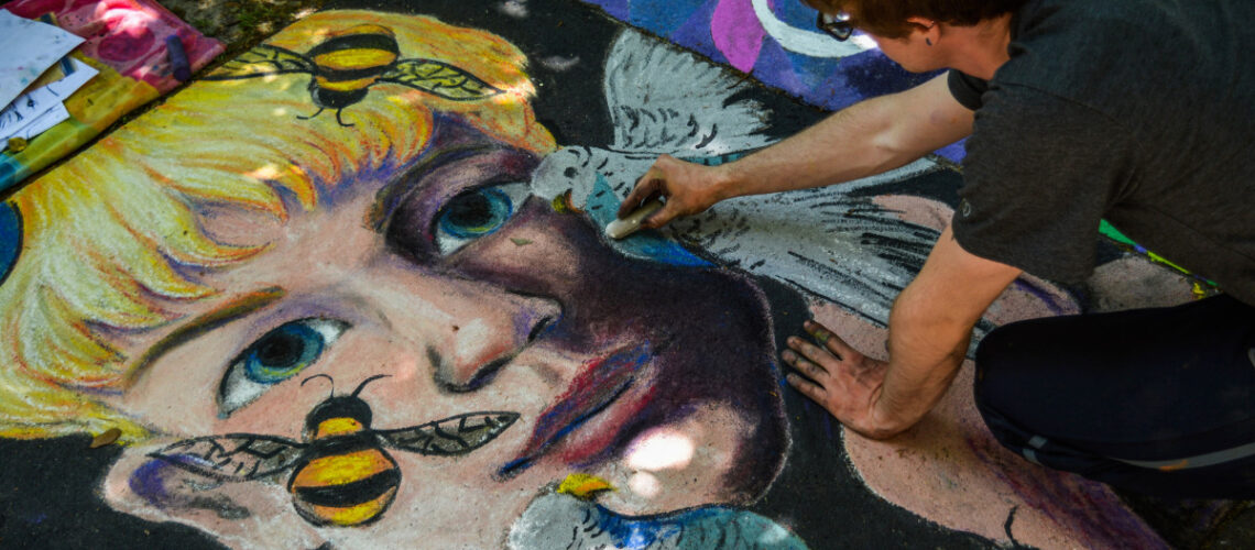 Person painting a portrait