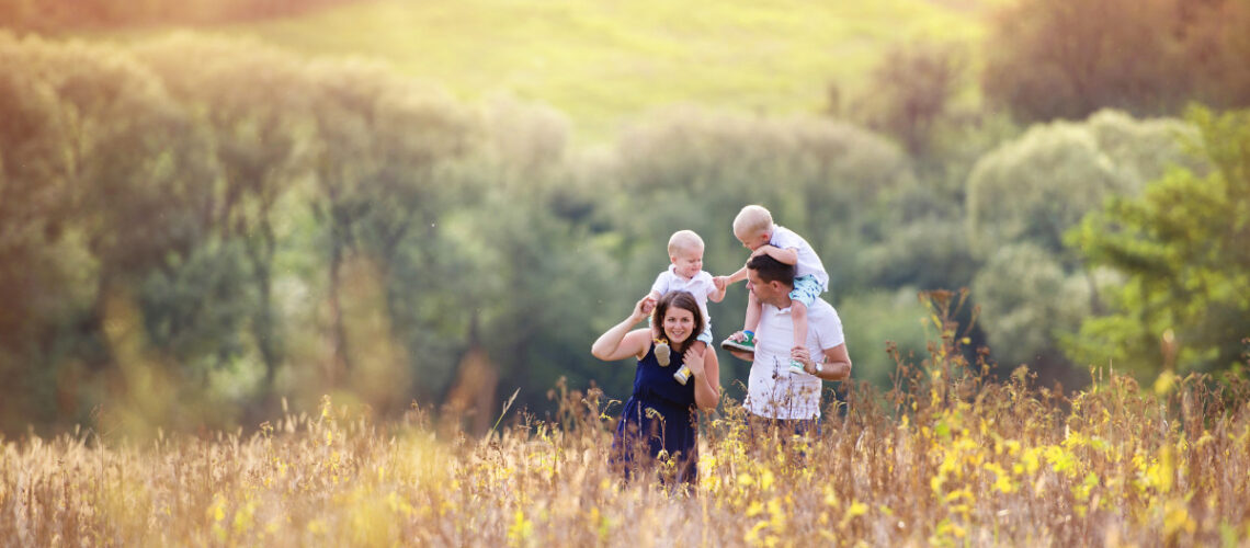 Family of four spending time outdoors