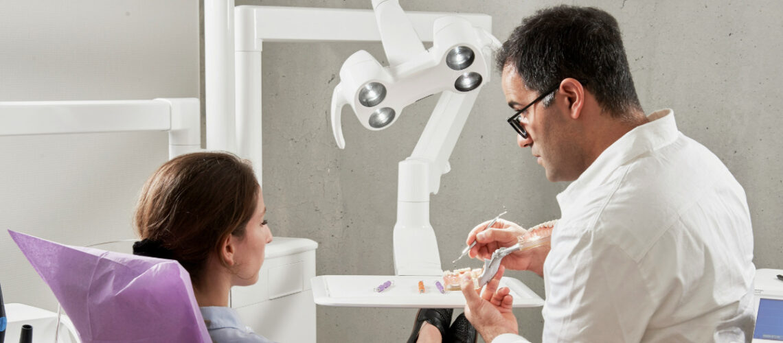 a woman talking to her dentist