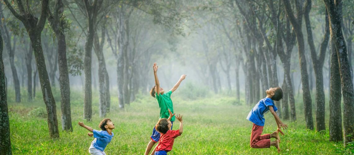 children playing with a ball in a field