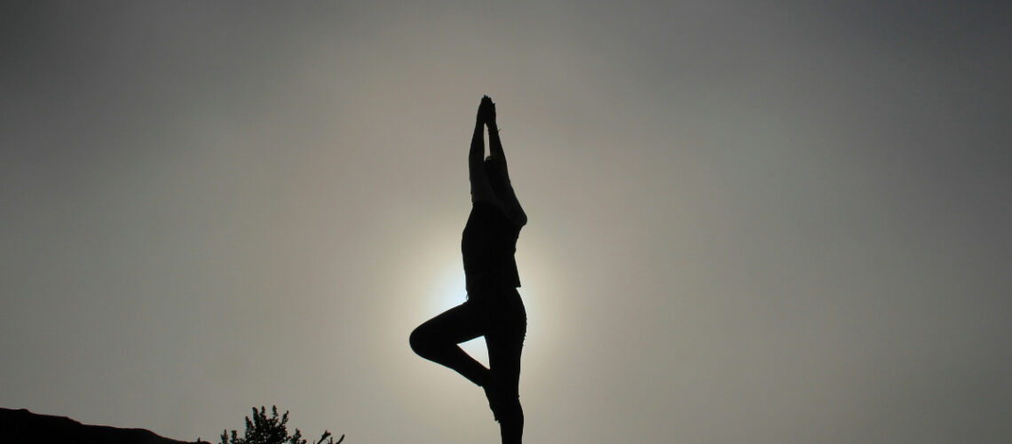 a person stretching and practicing health