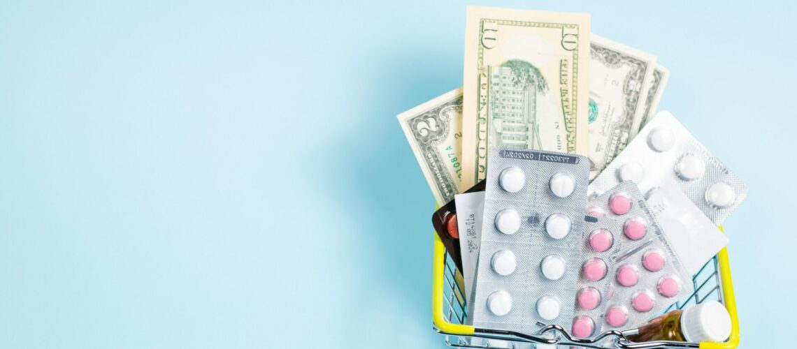 a wire basket with pills and money