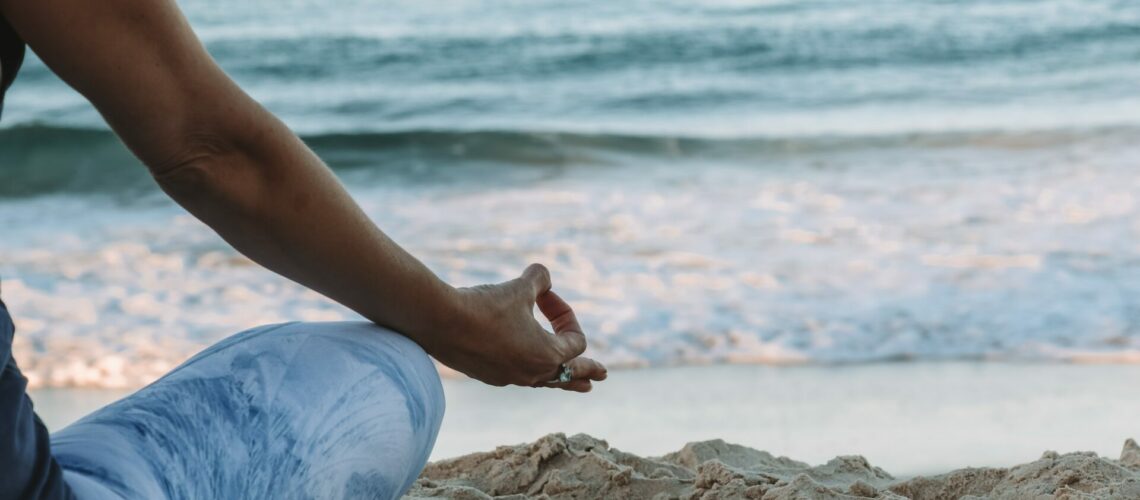 meditating at the beach