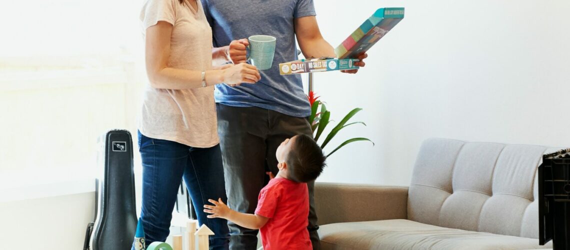 Couple with child looking at something to make a decision