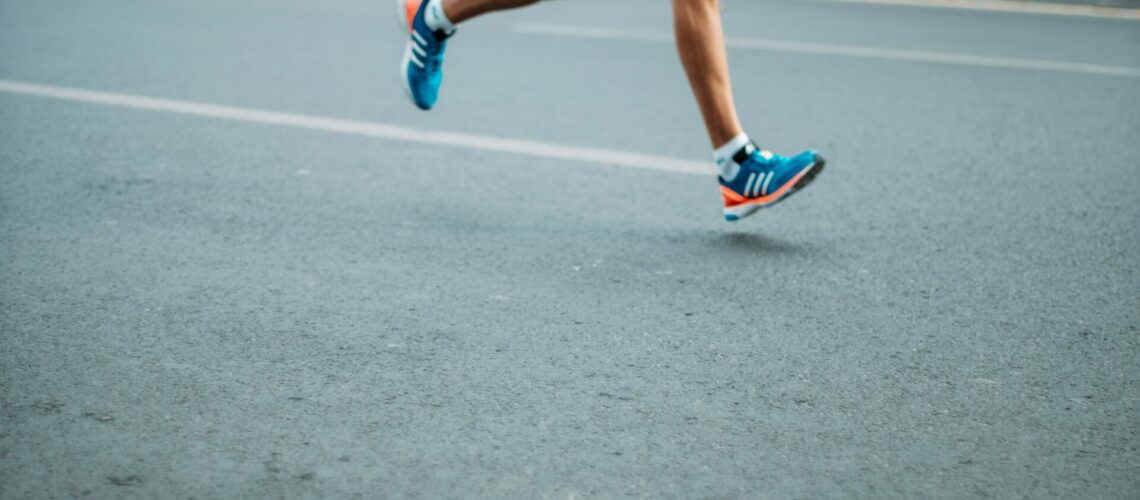 pair of blue-and-white Adidas running shoes